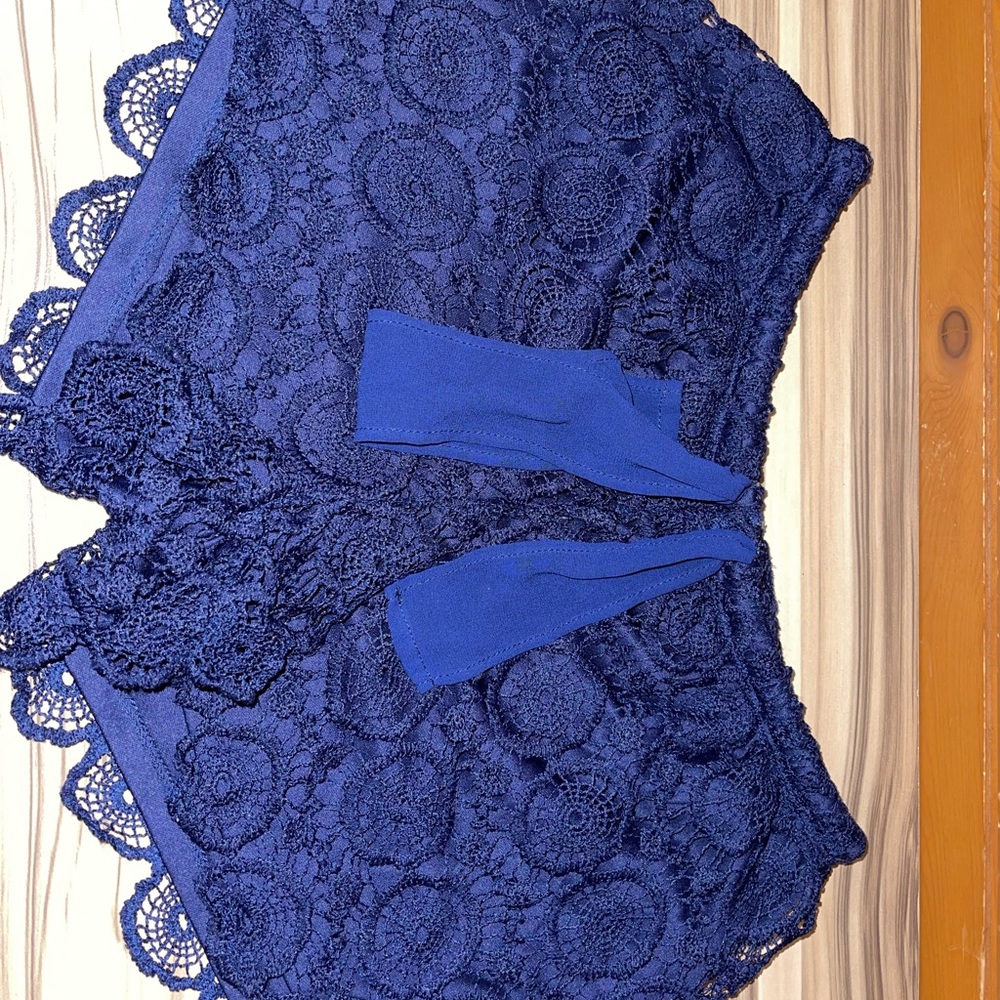 Nice royal blue short with lace details. Used one time only !